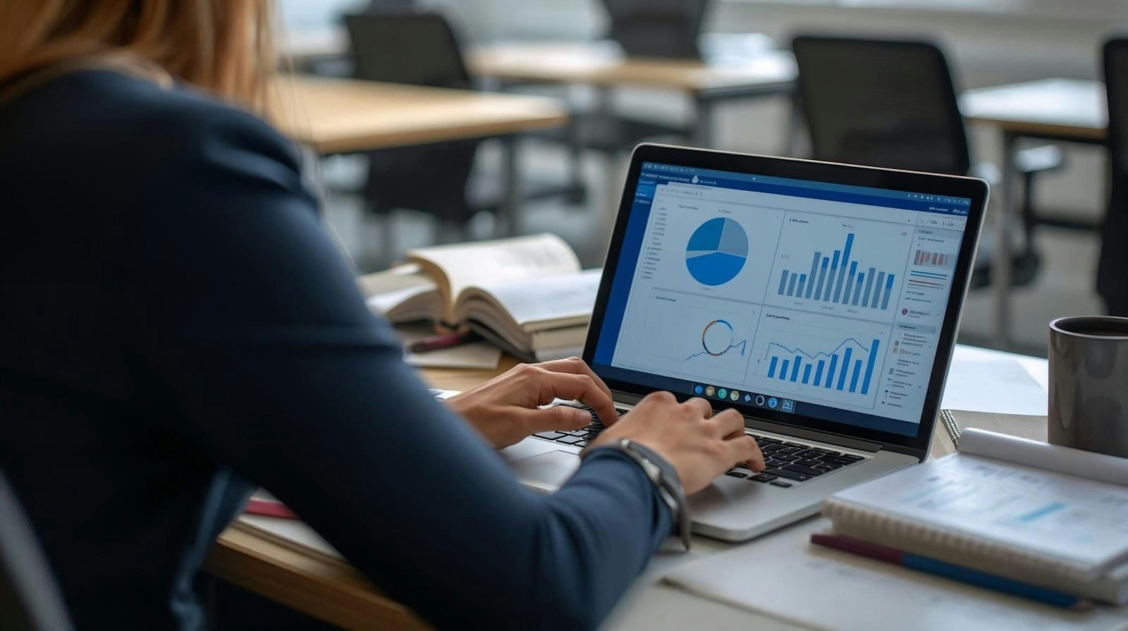 SEO analyst reviewing search performance data on a laptop